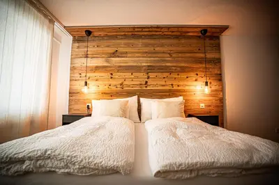 Ein Bett oder Betten in einem Zimmer der Unterkunft MALU appartment Zermatt