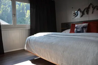 Ein Bett oder Betten in einem Zimmer der Unterkunft Q-Lodge 104