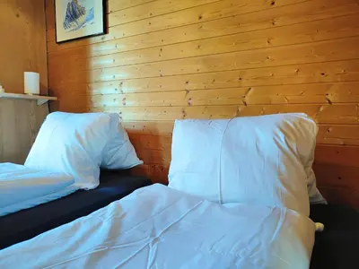 Ein Bett oder Betten in einem Zimmer der Unterkunft Schärmtanne entire chalet 15 min to Interlaken