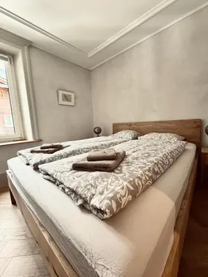 Ein Bett oder Betten in einem Zimmer der Unterkunft Art Residence, Beat Stähli
