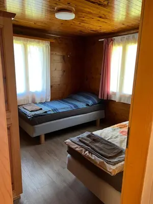 Ein Bett oder Betten in einem Zimmer der Unterkunft Alpen Rose 3 Wohnungen