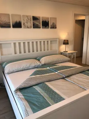 Ein Bett oder Betten in einem Zimmer der Unterkunft Bijou Waldeggli