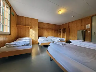 Ein Bett oder Betten in einem Zimmer der Unterkunft Nordic Arena House