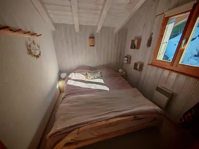 Ein Bett oder Betten in einem Zimmer der Unterkunft Chalet cosy avec vue incroyable