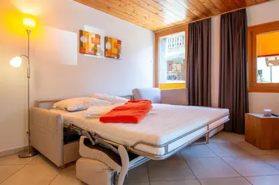 Ein Bett oder Betten in einem Zimmer der Unterkunft Fiesch, Ferienwohnung mit Aussensitzplatz