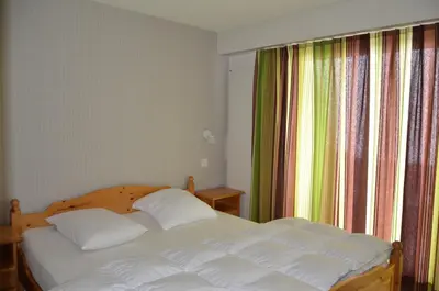 Ein Bett oder Betten in einem Zimmer der Unterkunft Immeuble Panorama