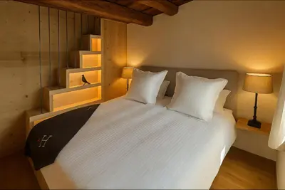 Ein Bett oder Betten in einem Zimmer der Unterkunft Les Mayens d'Adrien