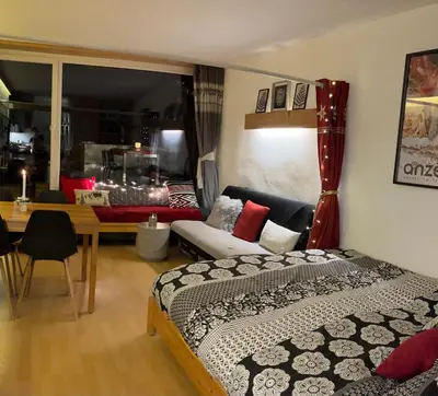 Ein Bett oder Betten in einem Zimmer der Unterkunft Studio chaleureux, confortable, avec vue sur les Alpes