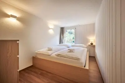 Ein Bett oder Betten in einem Zimmer der Unterkunft Lauterbrunnen Central 2