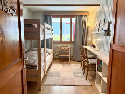 Ein Bett oder Betten in einem Zimmer der Unterkunft Fewo 'Alpegärtli' BeO Apartments