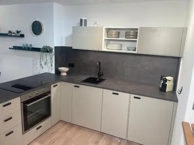 Küche/Küchenzeile in der Unterkunft Ambiente Appartement C2 - moderne Ferienwohnung mit Terrasse in Leukerbad