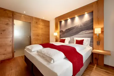 Ein Bett oder Betten in einem Zimmer der Unterkunft Apartments Crown Andermatt