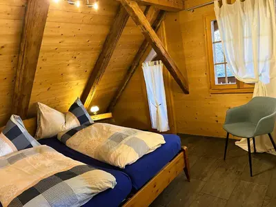 Ein Bett oder Betten in einem Zimmer der Unterkunft Ferienwohnung Haus Itten gemütlich und rustikal