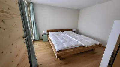 Ein Bett oder Betten in einem Zimmer der Unterkunft Lauchernalp - Neue Ferienwohnung ENYA