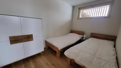 Ein Bett oder Betten in einem Zimmer der Unterkunft Lauchernalp - Neue Ferienwohnung ENYA