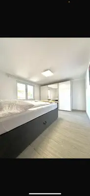 Ein Bett oder Betten in einem Zimmer der Unterkunft Home 2