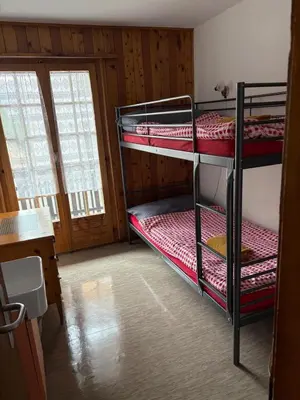 Ein Bett oder Betten in einem Zimmer der Unterkunft Séjour Edelweiss
