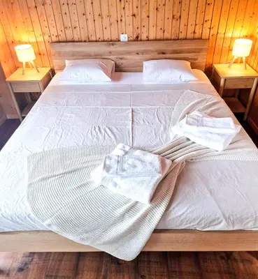 Ein Bett oder Betten in einem Zimmer der Unterkunft Chalet l'Aiglon Valais - Vue, Confort, Jacuzzi