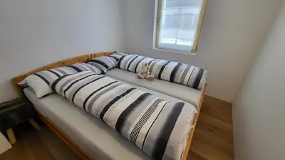 Ein Bett oder Betten in einem Zimmer der Unterkunft Belalp - schöne Ferienwohnung SOLELUNA