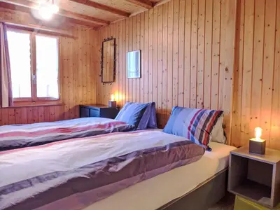 Ein Bett oder Betten in einem Zimmer der Unterkunft Holiday Home Chalet Träumli by Interhome