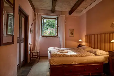 Ein Bett oder Betten in einem Zimmer der Unterkunft Wild Valley Secret Villa in Valle Onsernone
