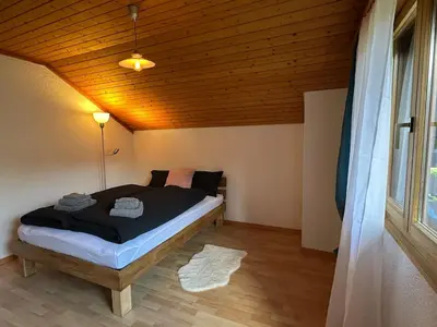 Ein Bett oder Betten in einem Zimmer der Unterkunft Chalet Rose - Einfamilienhaus