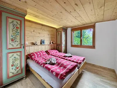Ein Bett oder Betten in einem Zimmer der Unterkunft Mountain Bliss, view and Sauna - Swiss Alps