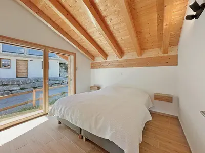 Ein Bett oder Betten in einem Zimmer der Unterkunft Chalet Teddy - Alpine Escape in the Swiss Alps