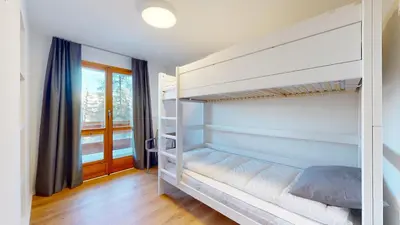 Ein Bett oder Betten in einem Zimmer der Unterkunft Chalet de lOurs AUTHENTIC Etage Penthes 14 pers