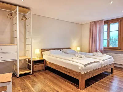 Ein Bett oder Betten in einem Zimmer der Unterkunft Apartment Chalet Adlerhorst EG by Interhome