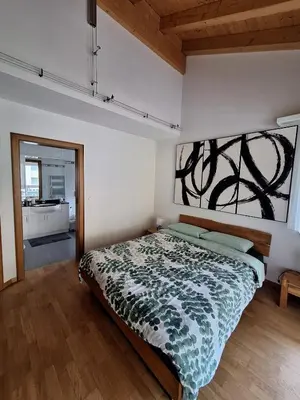 Ein Bett oder Betten in einem Zimmer der Unterkunft Charmant appartement à Leukerbad - Lovely apartment in Leukerbad