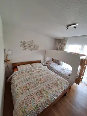 Ein Bett oder Betten in einem Zimmer der Unterkunft Charmant appartement à Leukerbad - Lovely apartment in Leukerbad