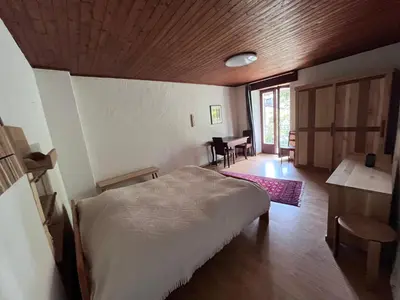 Ein Bett oder Betten in einem Zimmer der Unterkunft Schönes Rustico in bester Lage - 2 min an den See