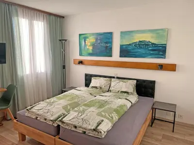 Ein Bett oder Betten in einem Zimmer der Unterkunft Hotel Bellevue