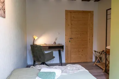 Ein Bett oder Betten in einem Zimmer der Unterkunft BnB Feuille de Vigne
