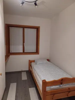 Ein Bett oder Betten in einem Zimmer der Unterkunft Birdy's House, duplex jusqu'à 9 pers à Savièse