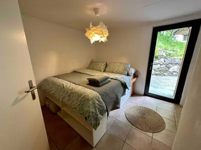 Ein Bett oder Betten in einem Zimmer der Unterkunft Cozy Rustic Prato Sornico