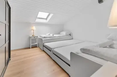 Ein Bett oder Betten in einem Zimmer der Unterkunft Attique rénové avec jacuzzi 6 pers à Savièse