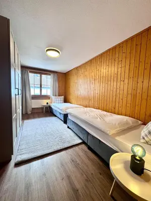 Ein Bett oder Betten in einem Zimmer der Unterkunft Chalet Gemsblick