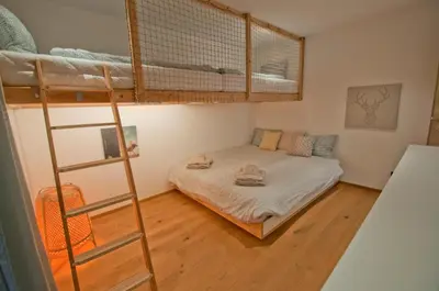 Ein Bett oder Betten in einem Zimmer der Unterkunft Chalet Sunnustrahl