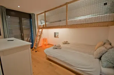 Ein Bett oder Betten in einem Zimmer der Unterkunft Chalet Sunnustrahl