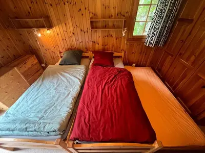 Ein Bett oder Betten in einem Zimmer der Unterkunft Appartement avec jardin au coeur de la nature