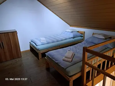 Ein Bett oder Betten in einem Zimmer der Unterkunft Weisses Haus