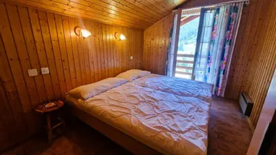 Ein Bett oder Betten in einem Zimmer der Unterkunft Chalet Lu Verzache 5 personnes