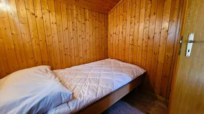 Ein Bett oder Betten in einem Zimmer der Unterkunft Chalet Lu Verzache 5 personnes