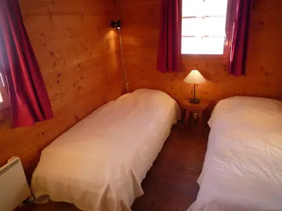 Ein Bett oder Betten in einem Zimmer der Unterkunft Chalet Le Recoulet 8 personnes - Evolene