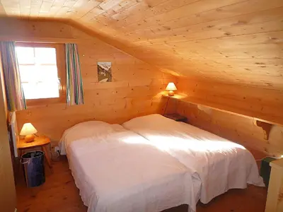 Ein Bett oder Betten in einem Zimmer der Unterkunft Chalet Le Recoulet 4 personnes - Evolene