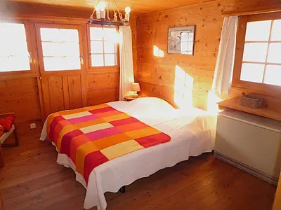 Ein Bett oder Betten in einem Zimmer der Unterkunft Chalet Le Recoulet 4 personnes - Evolene