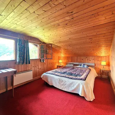 Ein Bett oder Betten in einem Zimmer der Unterkunft Tourbillon Gerber - Chalet authentique La Sage