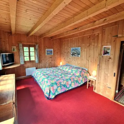 Ein Bett oder Betten in einem Zimmer der Unterkunft Tourbillon Gerber - Chalet authentique La Sage